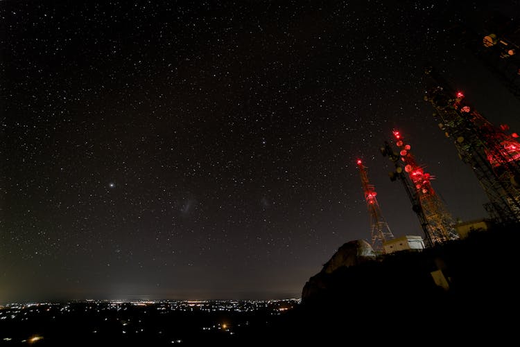 Starry Sky Over Illuminated City