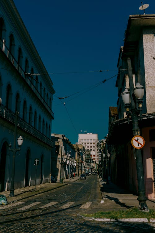 An Empty Street Between Buildings