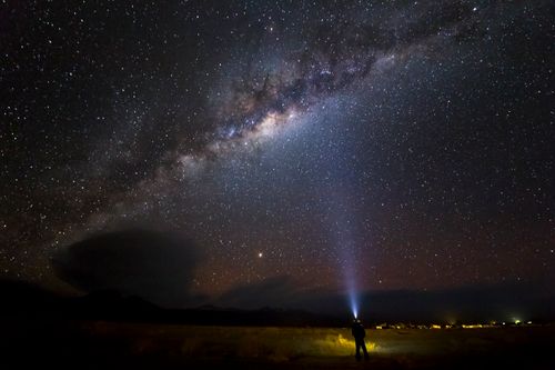 Free A person gazing at the Milky Way in San Pedro de Atacama, Chile. Ideal for celestial themes. Stock Photo