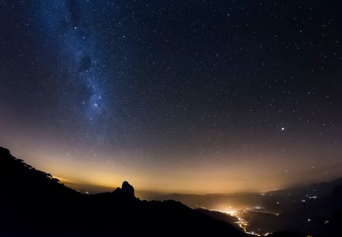 Free Spectacular view of a starry night sky and city lights from São Bento do Sapucaí, Brazil. Stock Photo