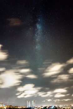 Breathtaking view of the Milky Way illuminating the night sky over São Paulo cityscape.