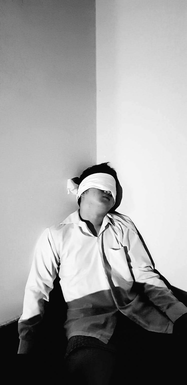 Man In White Long Sleeve Shirt Blindfolded