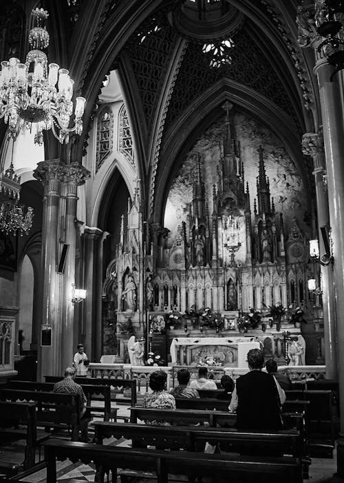 Grayscale Photo of People Inside Cathedral