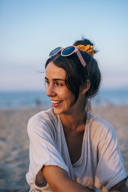 Woman in White Shirt Wearing Pink Sunglasses