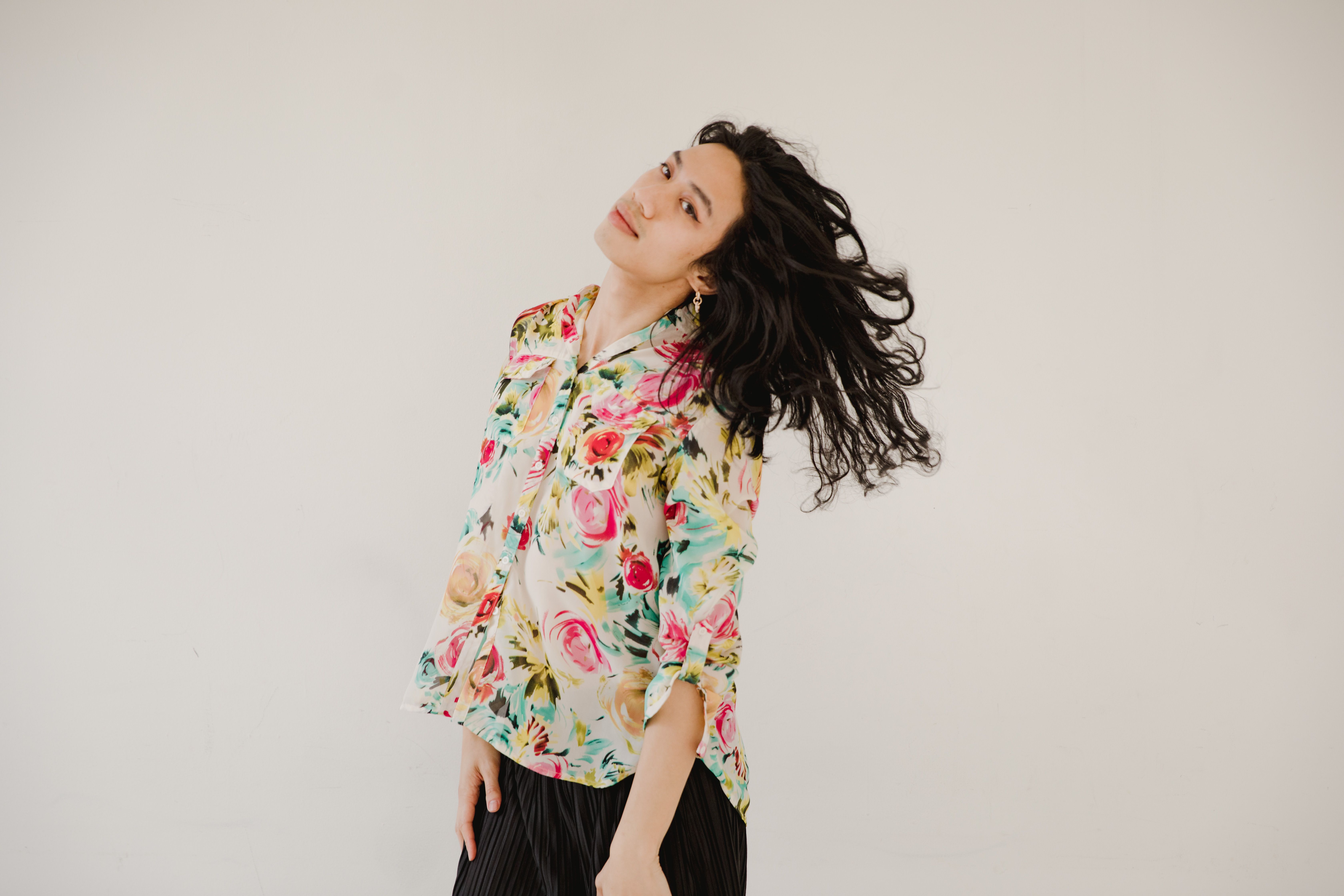 Heart print silk blouse with black trousers