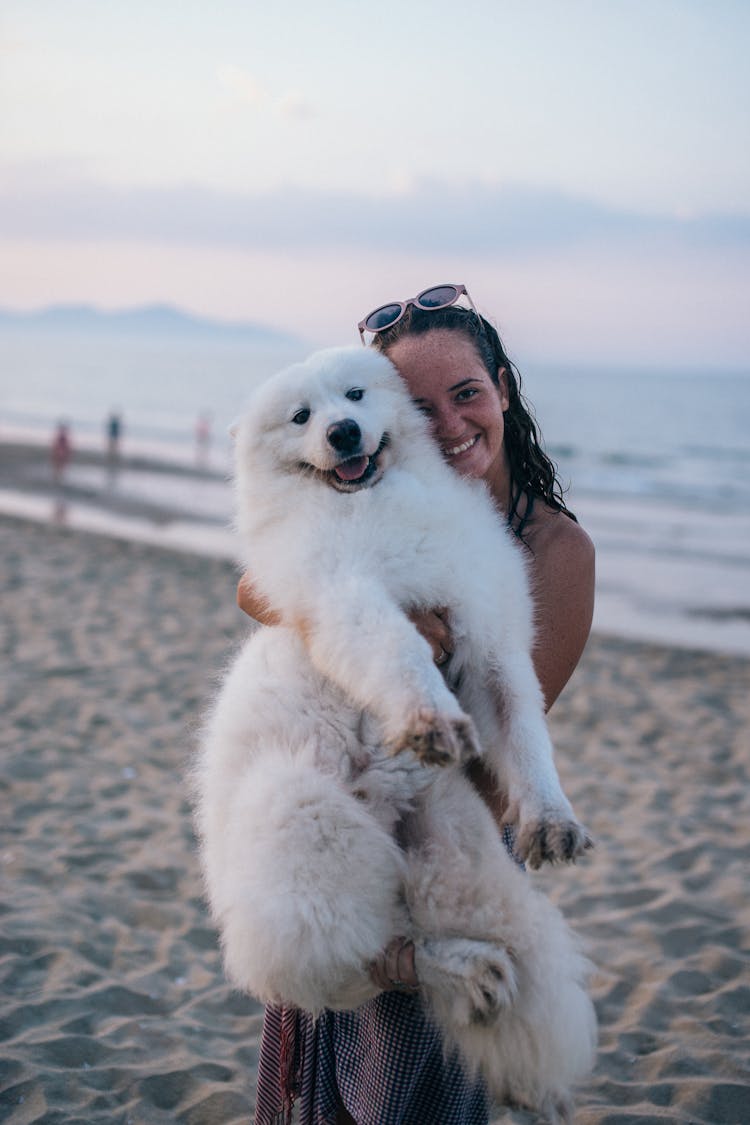 A Woman Posing With Her Pet Dog