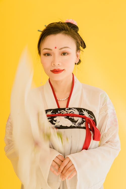 A Woman in White Hanfu Dress Smiling