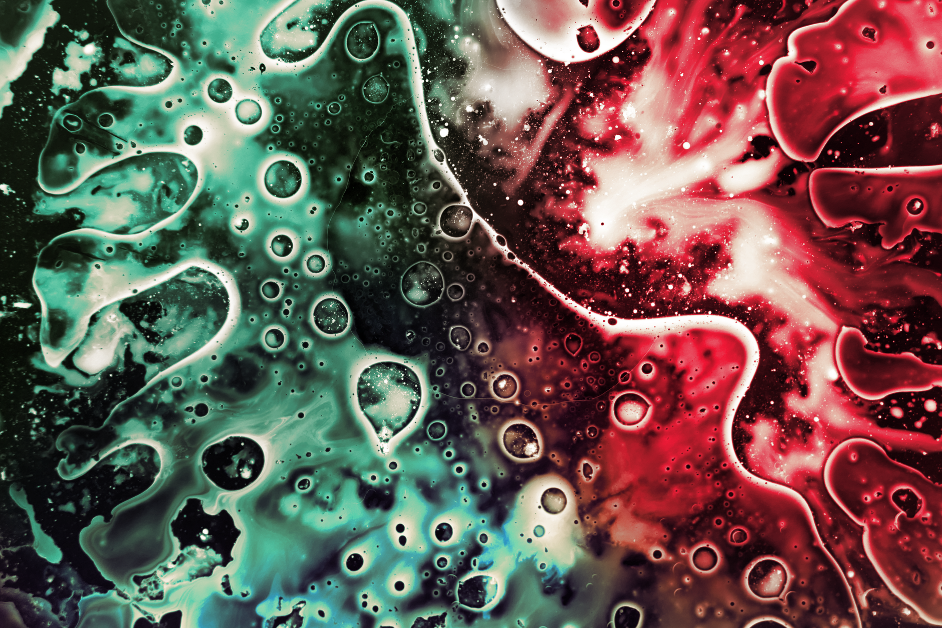 Colorful abstract artwork featuring vibrant fluid patterns and bubbles in red and green hues.