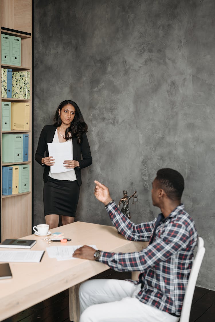 A Man Talking To A Lawyer