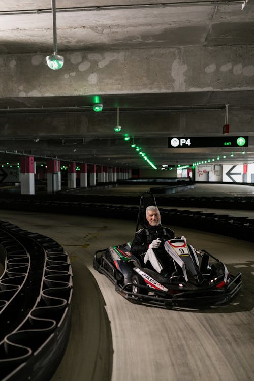 Ederly Man riding a Kart Wheel 