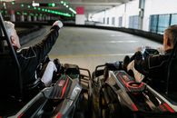 Backview of Two People riding Kart Wheels