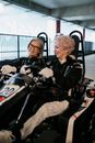 Close-up Photo of Elderly Women riding Go Kart