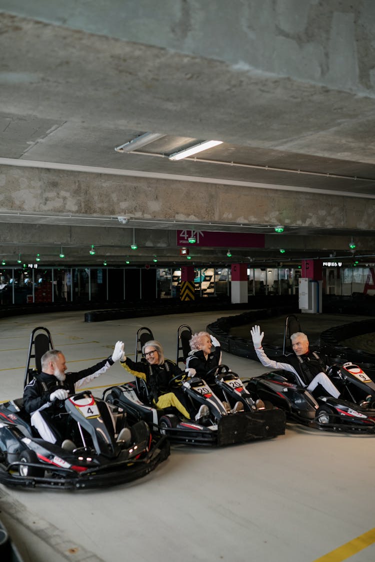 Group Of People Sitting On Go Karts