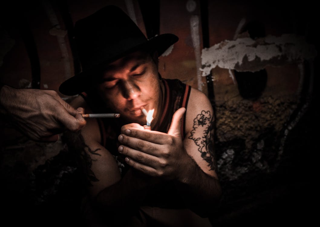 Free Man Lighting Cigarette Stock Photo