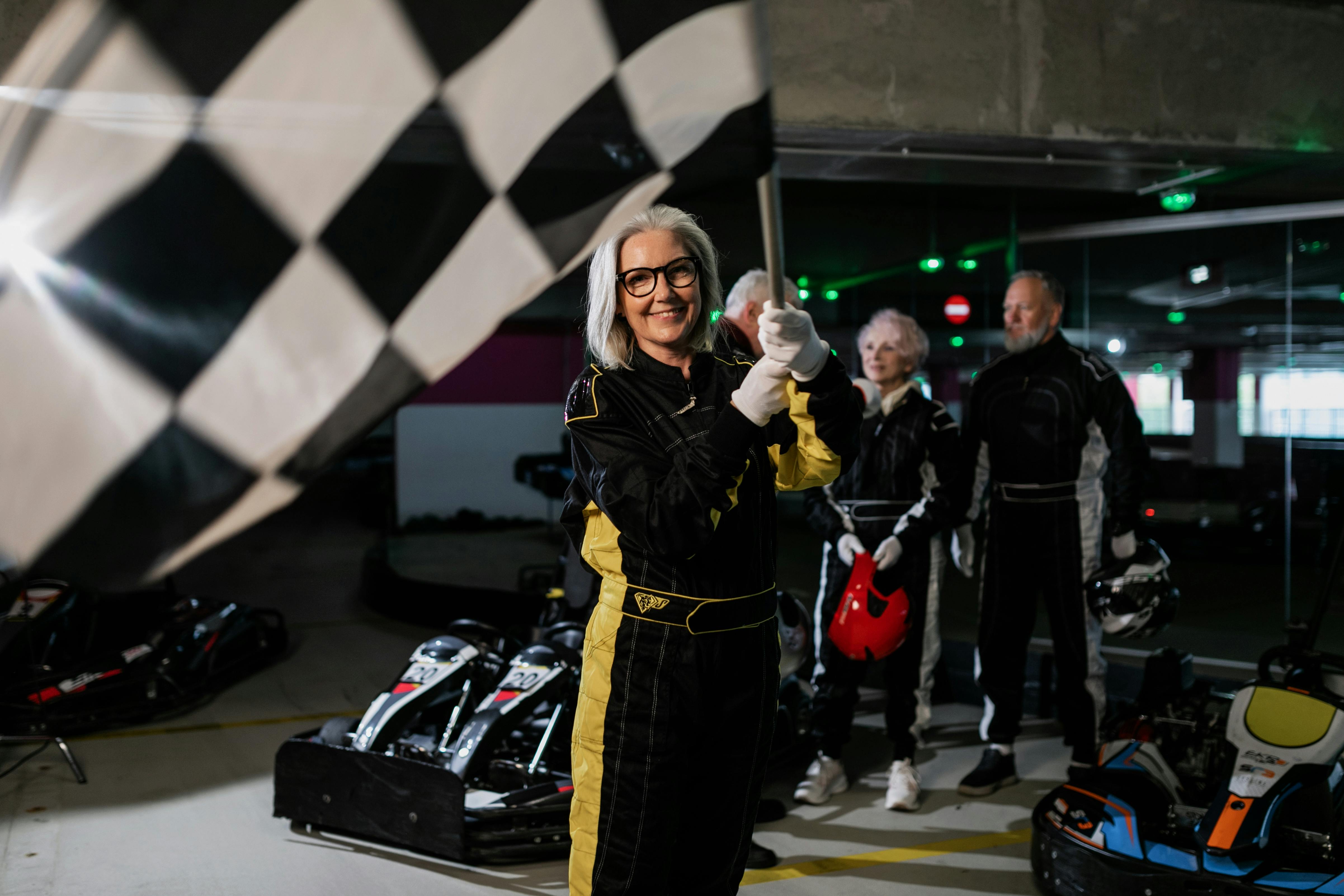 Elderly Woman holding a Race Flag