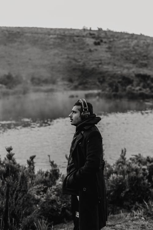 Man in Black Jacket Standing Near Lake
