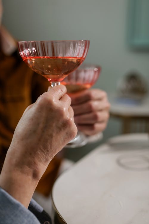 Close-up Photo of Wine Glass held by a Person 