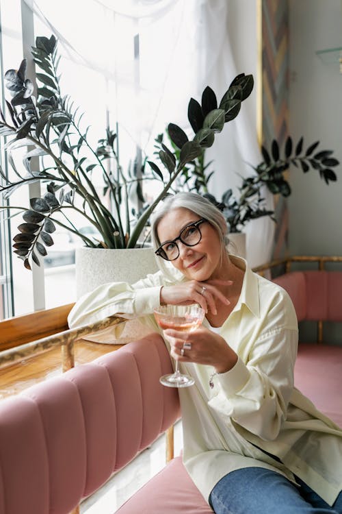 Elderly Woman holding a Wine Glass