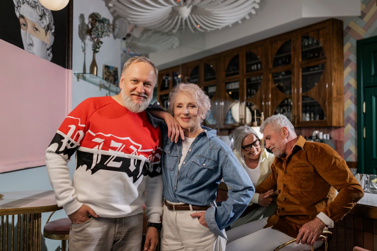 Older adults enjoying time together in a warm social setting