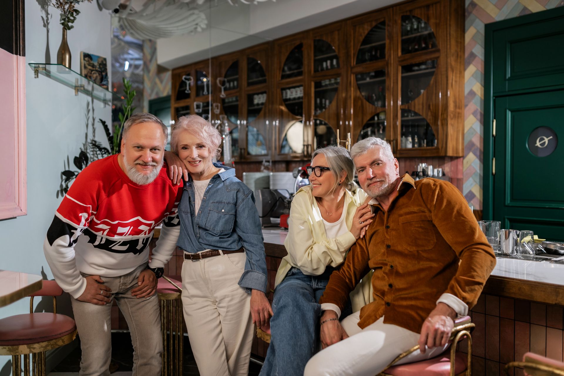 Senior friends enjoying each other's company at a cafe, celebrating togetherness and friendship.