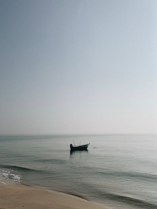 Free Boat in the Sea Stock Photo