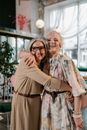 Happy Elderly Woman hugging each other
