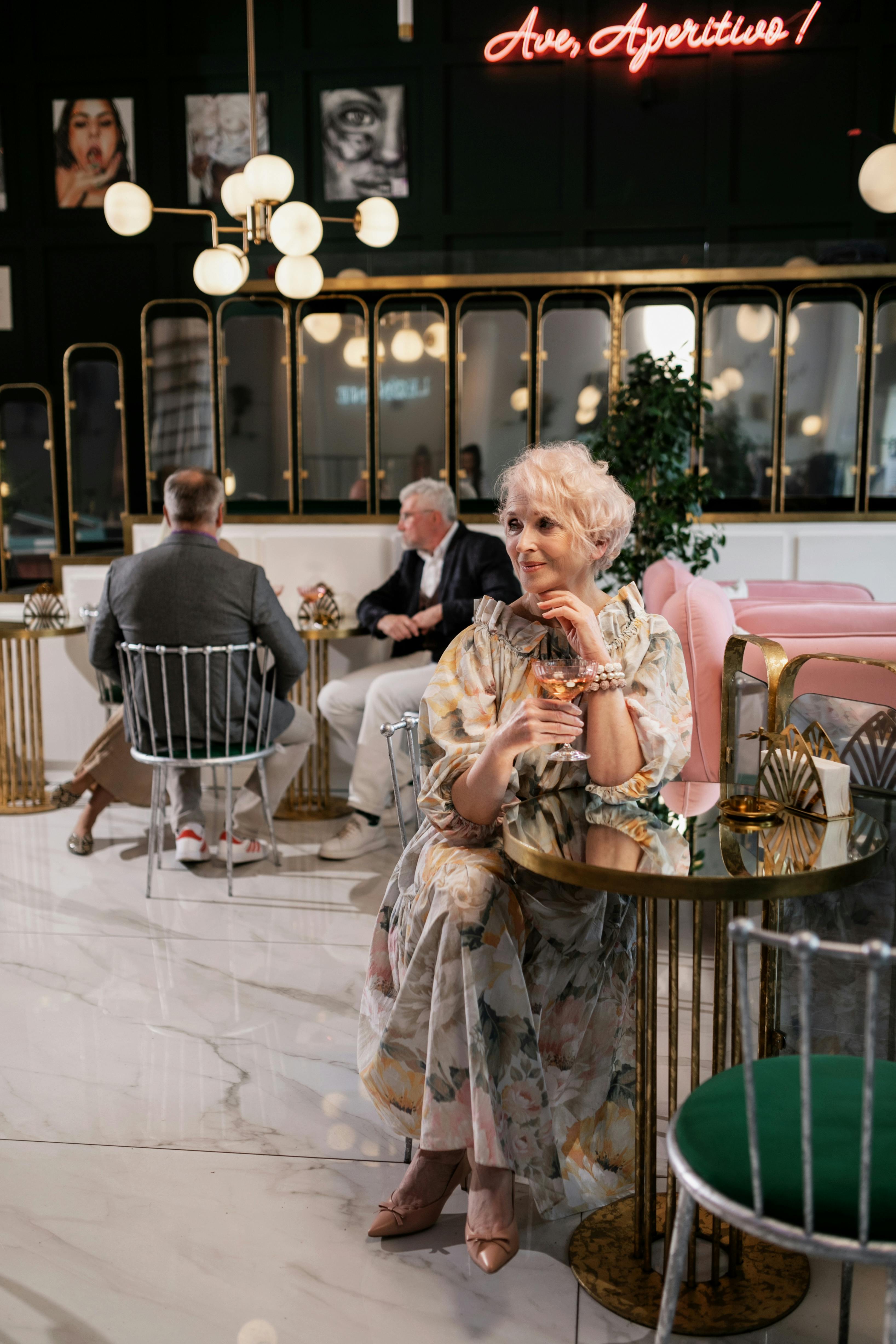 Elegant mature woman in a beautiful floral dress — how to wear patterns and prints after 60