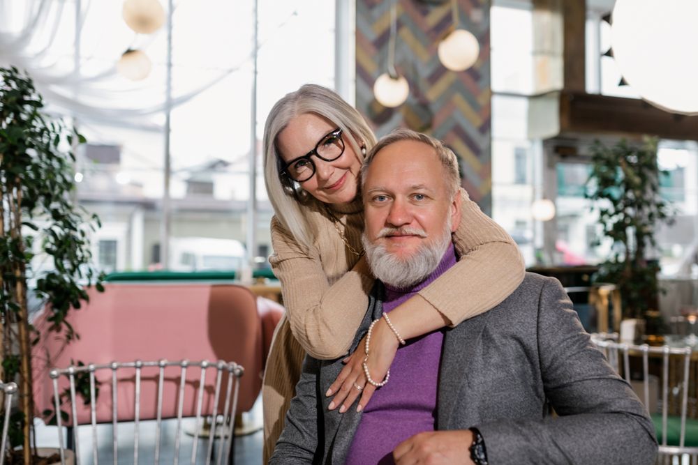 A senior couple relaxing together at a neighborhood cafe