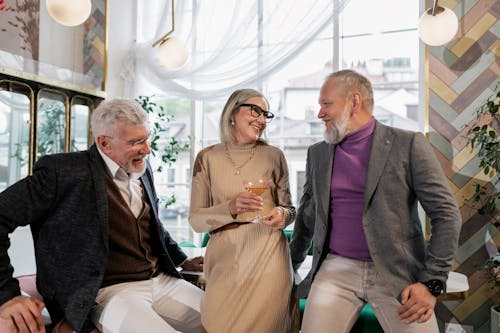 An Elderly Woman Holding Her Drink