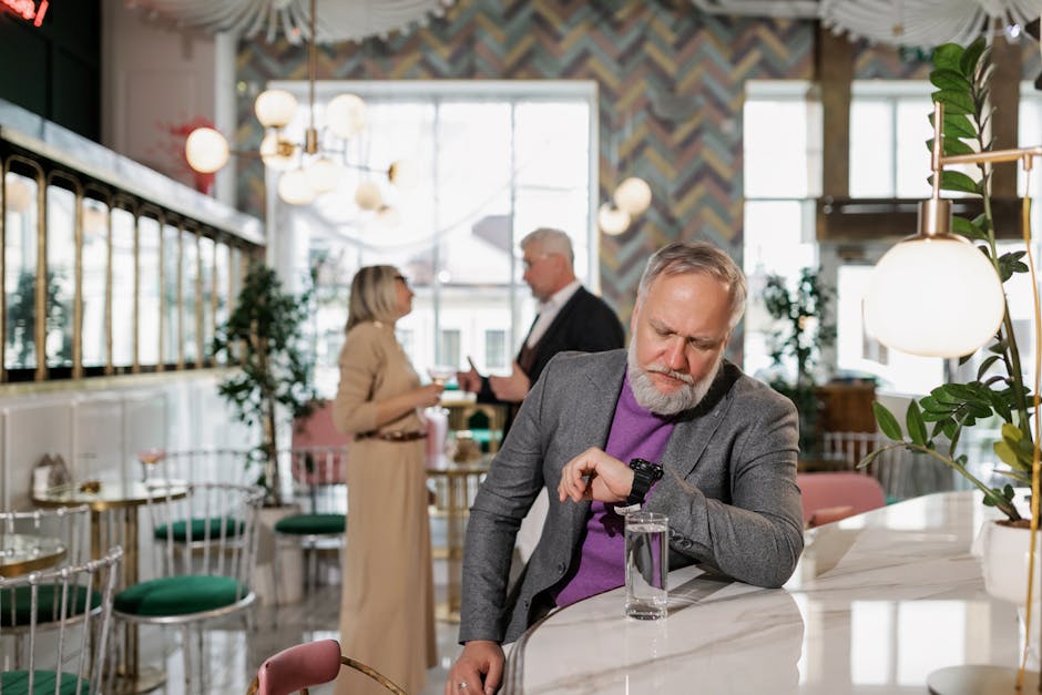 Person checking watch while waiting at meeting point