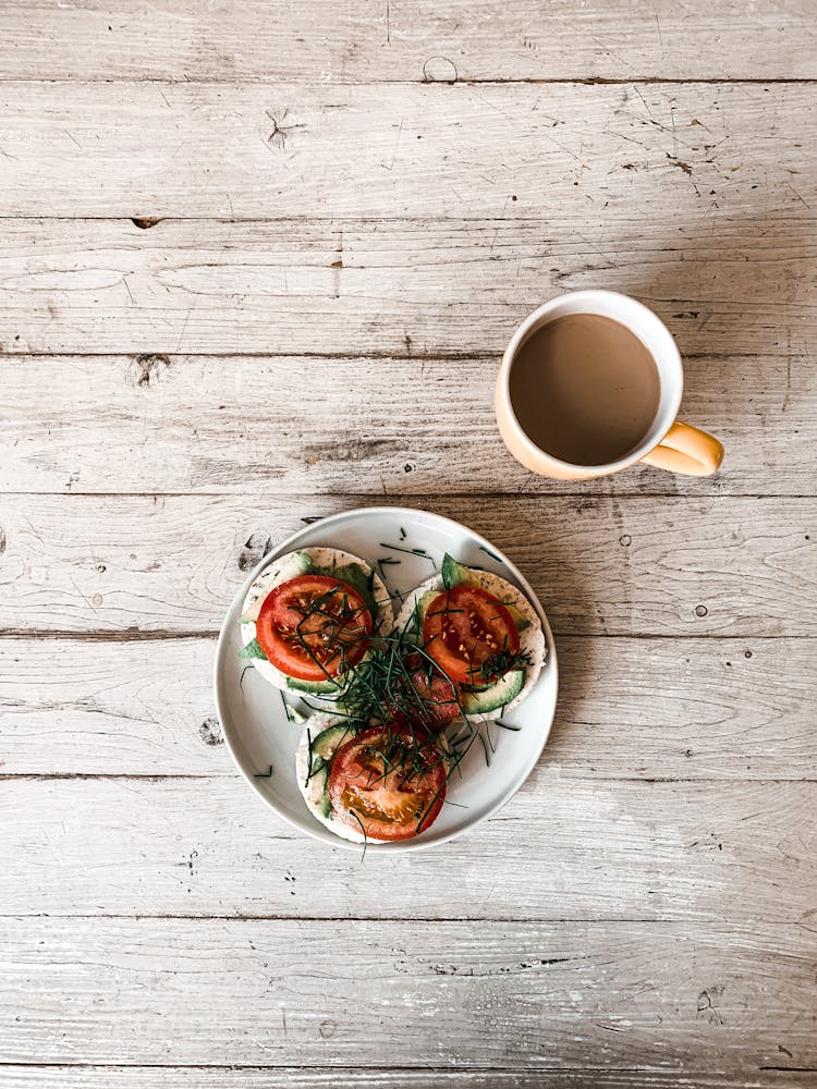 Sandwiches On Rice Cakes And A Cup Of Coffee