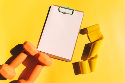 Clipboard on Yellow Surface