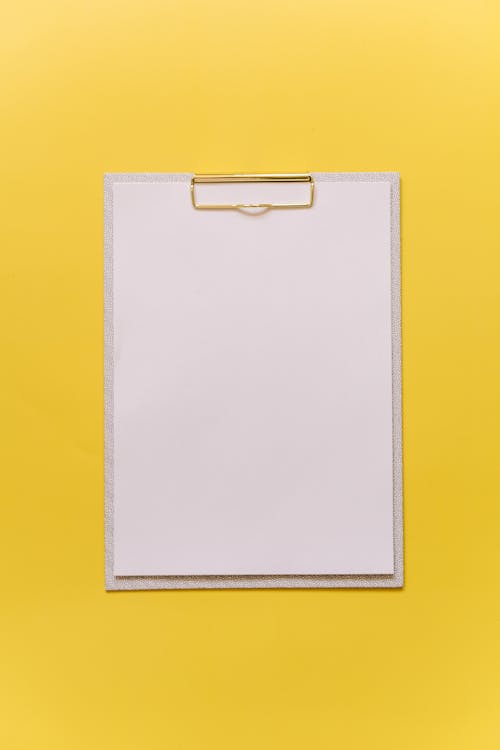 Clipboard on a Yellow Surface