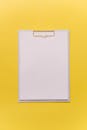 Clipboard on a Yellow Surface