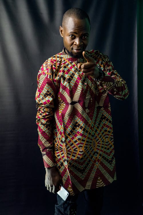 Man in Aztec Print Long Sleeves Shirt Pointing Finger 