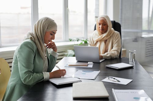 Free Women Working in an Office Stock Photo