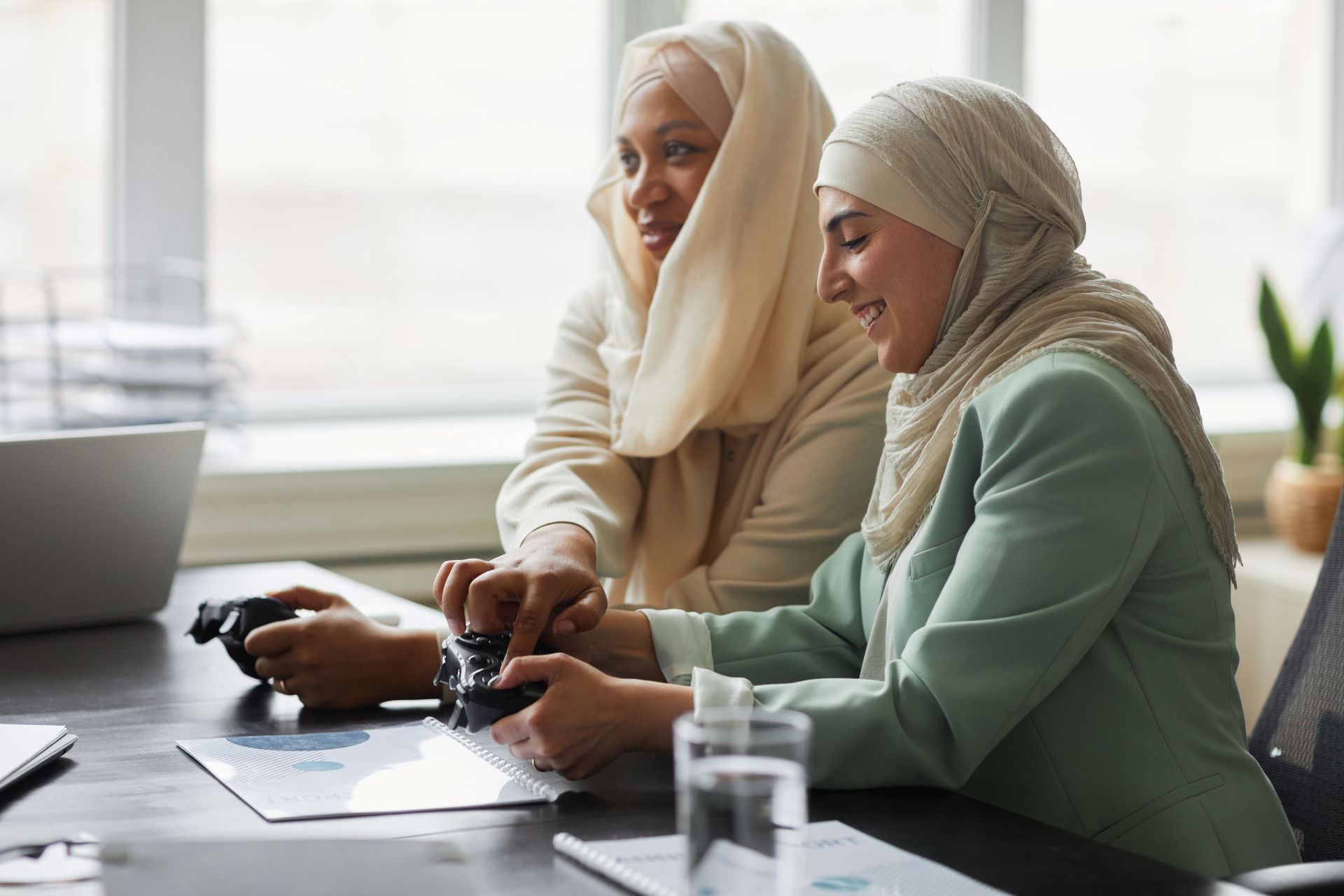 Women Playing a Video Game Together at an Office