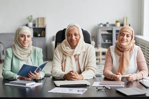 Free Women in Hijab Sitting Together Stock Photo