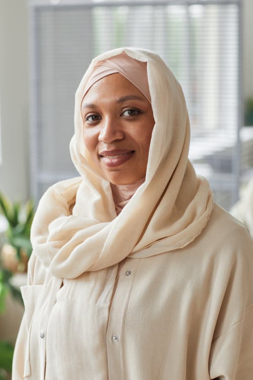 Woman in Beige Long Sleeve Shirt Wearing Beige Hijab