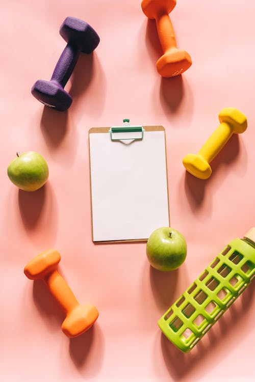 Gym Equipments on Peach Background