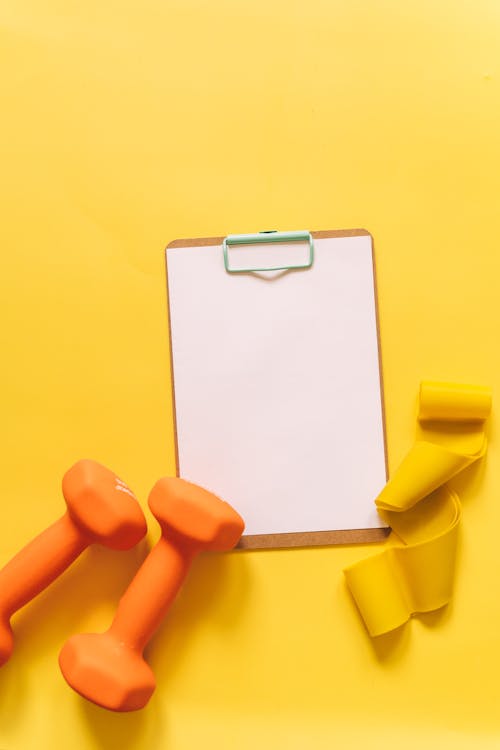 Blank White Paper on Yellow Background