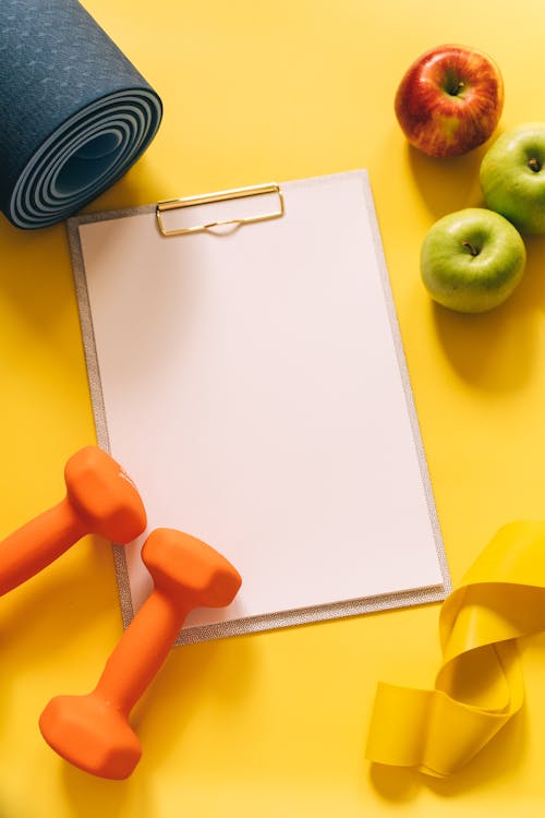 Blank White Paper on Yellow Background