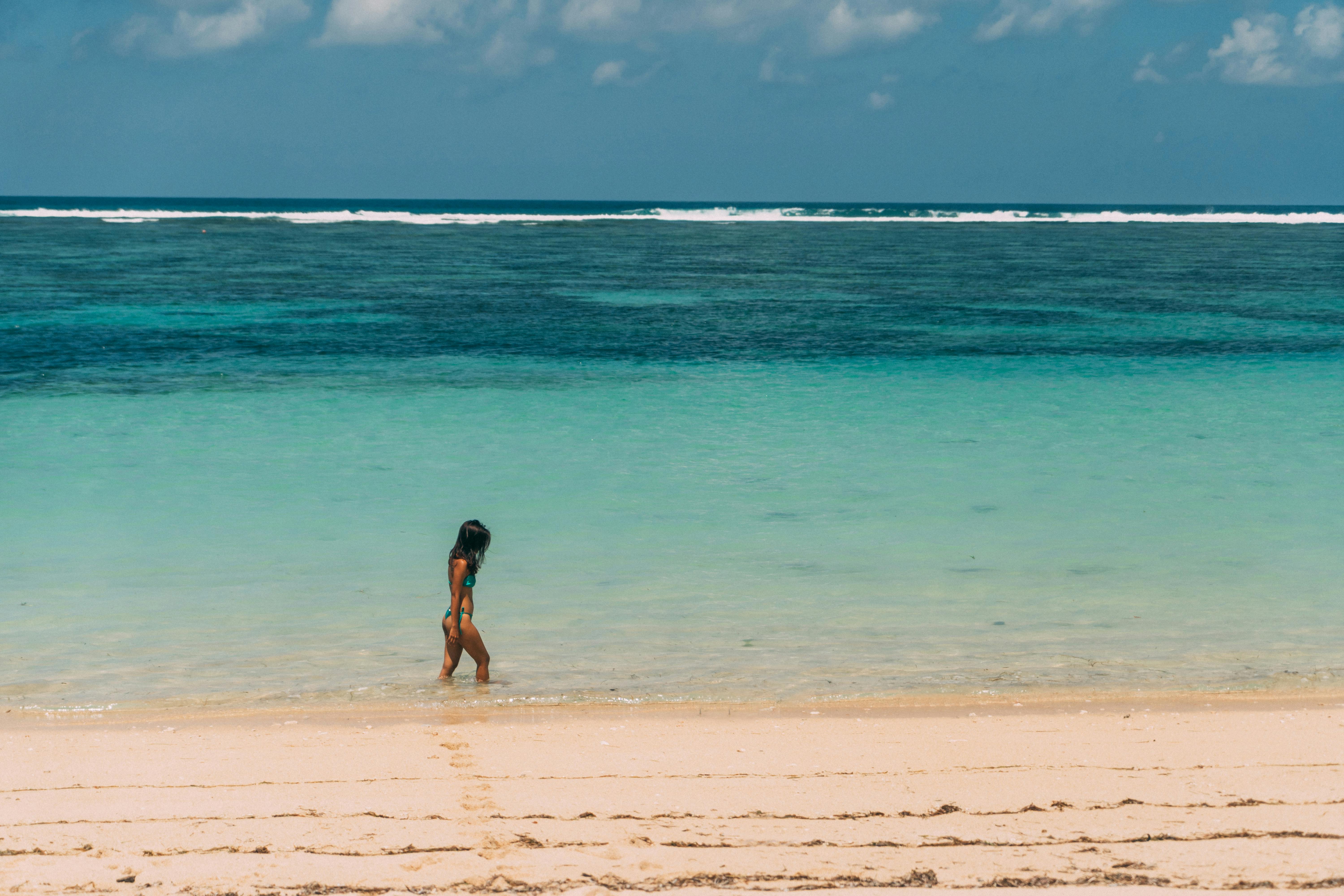 Photo of Women Wearing a Bikini on Beach · Free Stock Photo