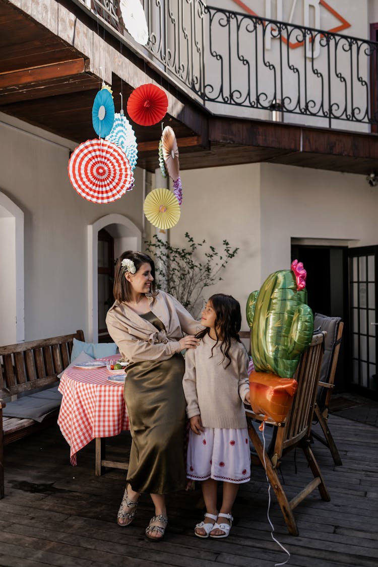 A Mother And Daughter In A Party