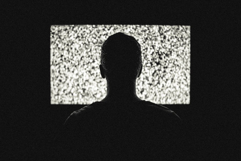 Silhouette of Man in Front of Tv