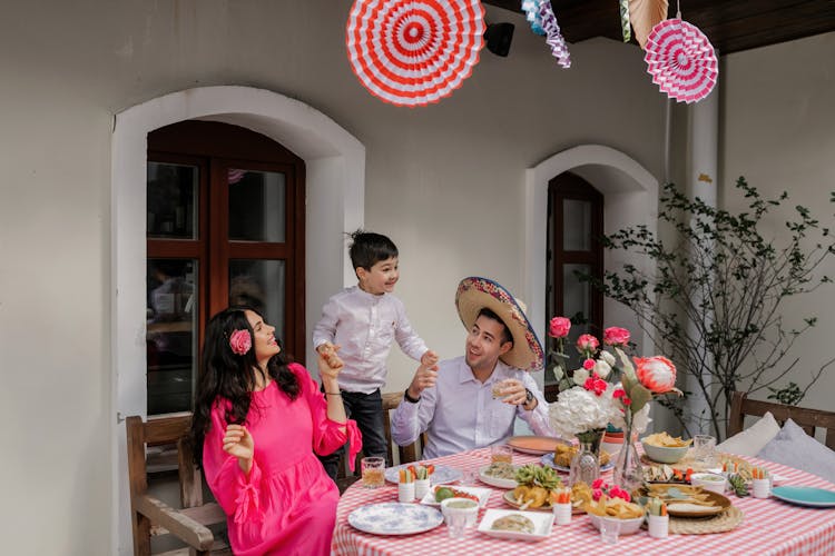 A Family Sitting At The Table