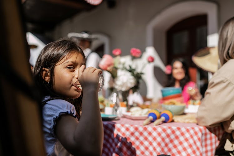 A Young Girl Drinking Water 