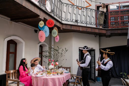 A joyful family celebration featuring live mariachi music in a vibrant outdoor setting.