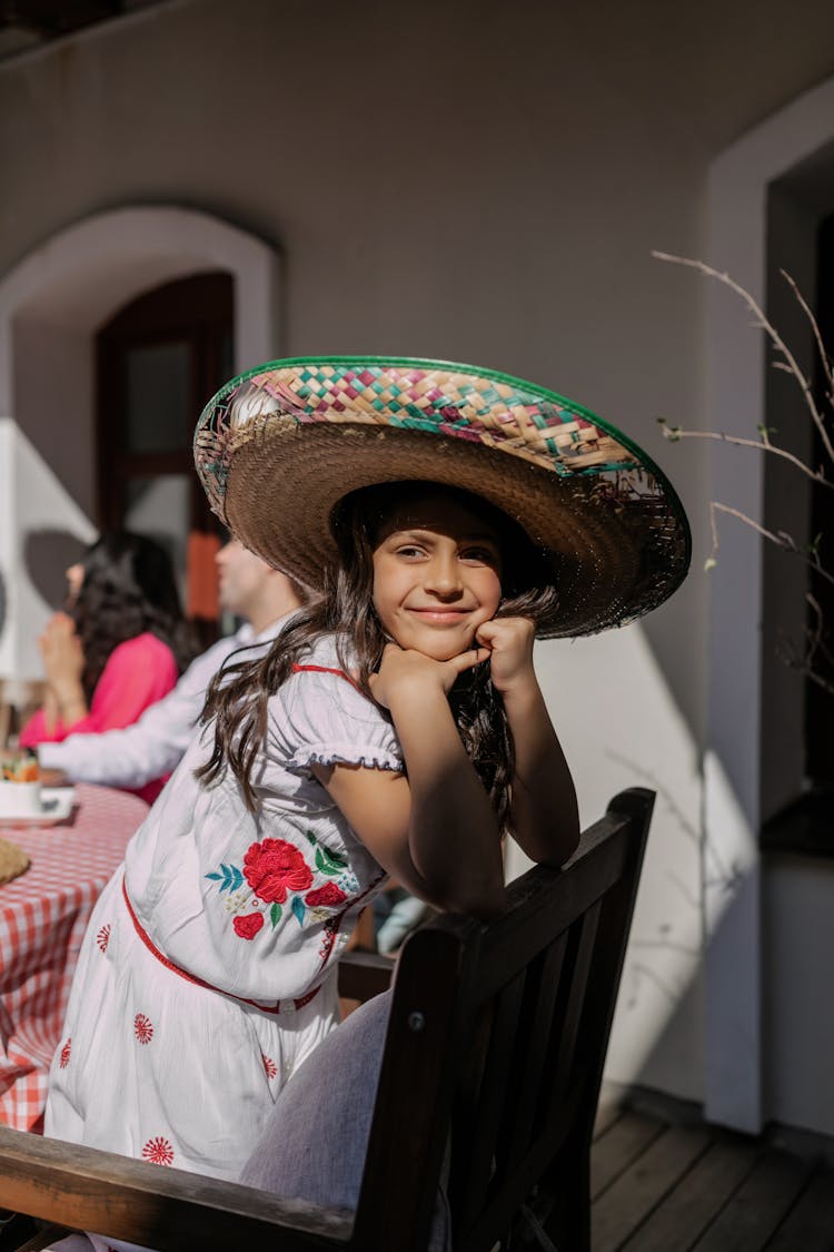 Girl In Sombrero And White Dress