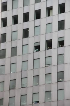 Close-up of a modern office building facade showcasing grid windows in Japan.
